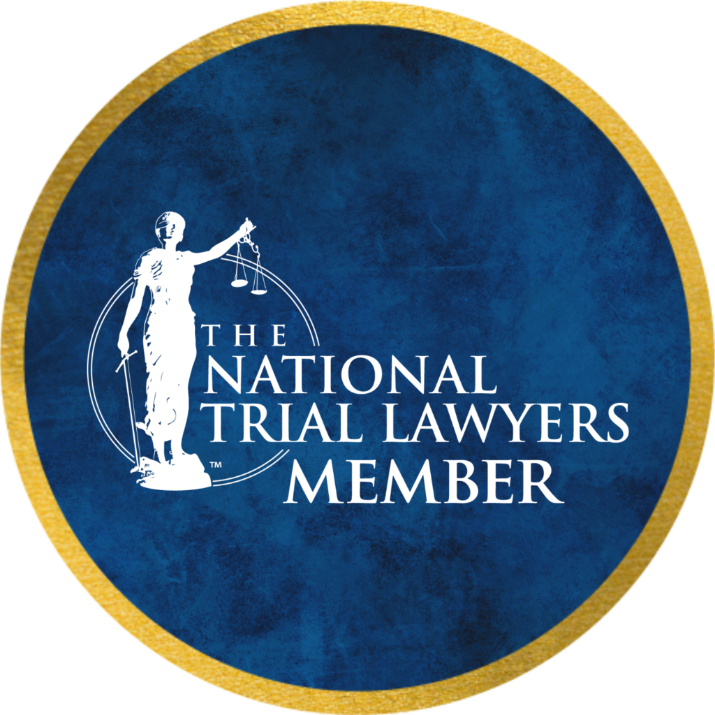 Blue circular badge with a gold rim reading 'The National Trial Lawyers Member' and a white Lady Justice with scales.